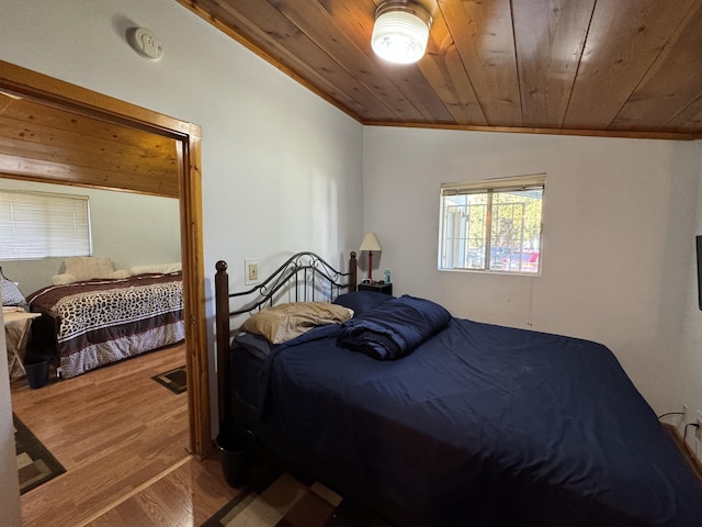 bedroom featuring wooden ceiling, hardwood / wood-style flooring, and lofted ceiling