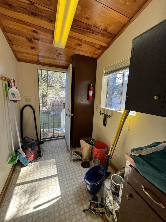 interior space featuring tile floors and wood ceiling