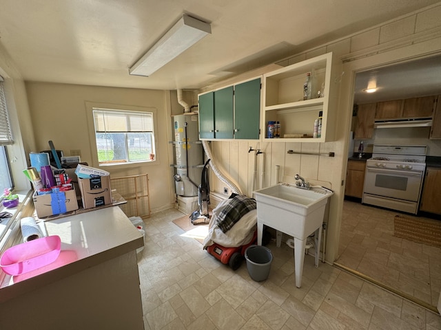 interior space featuring strapped water heater and light tile floors