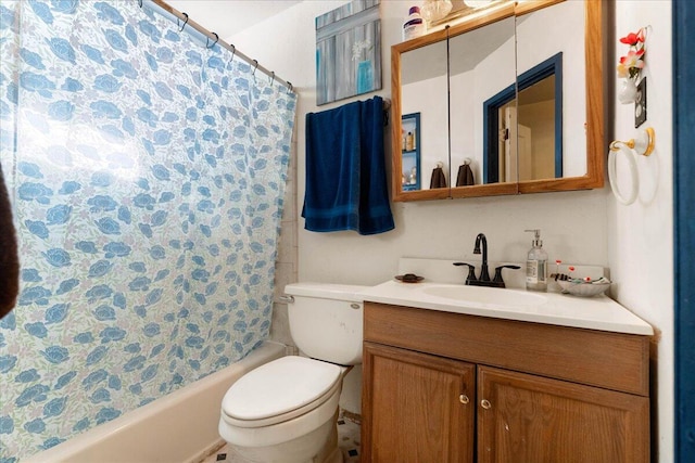 full bathroom featuring shower / tub combo, vanity, and toilet