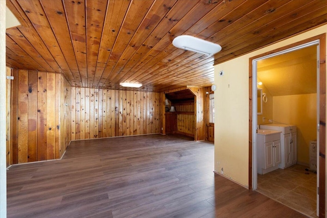 bonus room featuring wooden walls, wooden ceiling, and light hardwood / wood-style floors