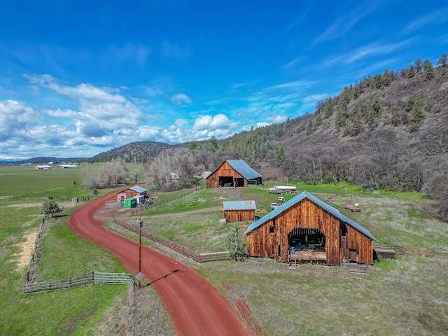 exterior space with a rural view and a mountain view