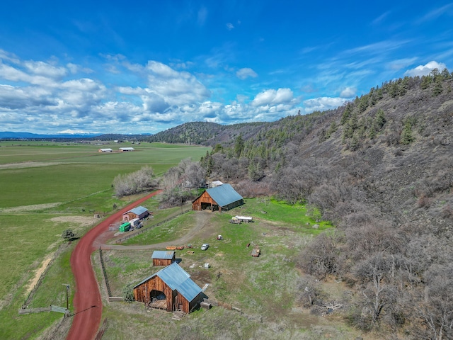 birds eye view of property with a rural view and a mountain view