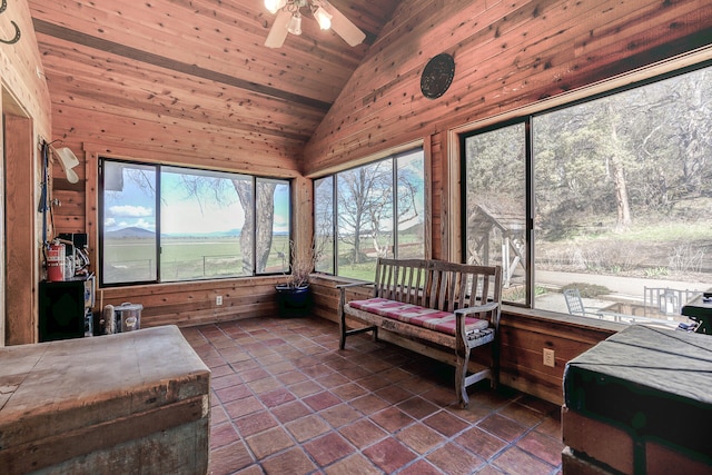 sunroom / solarium featuring lofted ceiling, plenty of natural light, wooden ceiling, and ceiling fan