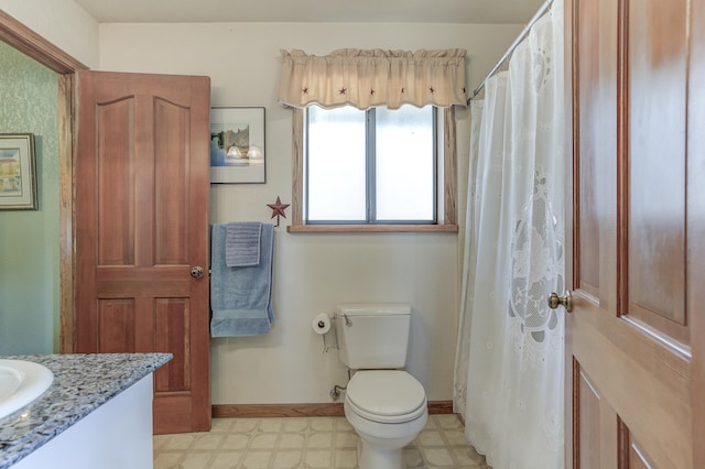 full bath featuring vanity, tile patterned floors, toilet, and baseboards