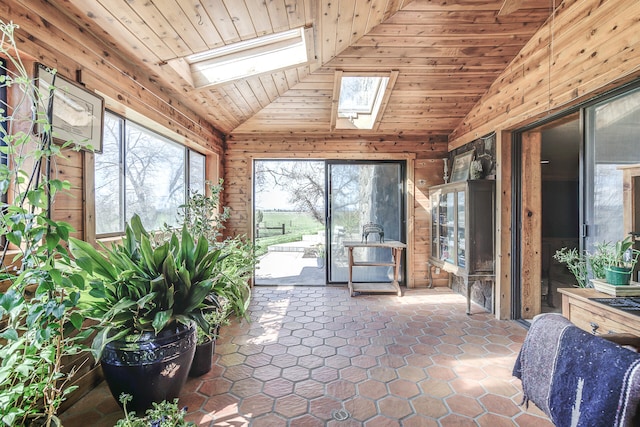 unfurnished sunroom with vaulted ceiling with skylight and wooden ceiling