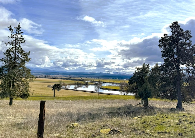 mountain view with a rural view and a water view