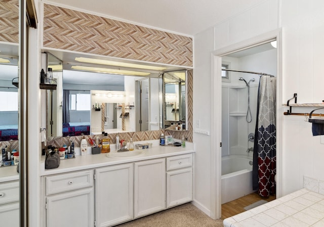 bathroom with shower / bath combination with curtain and vanity