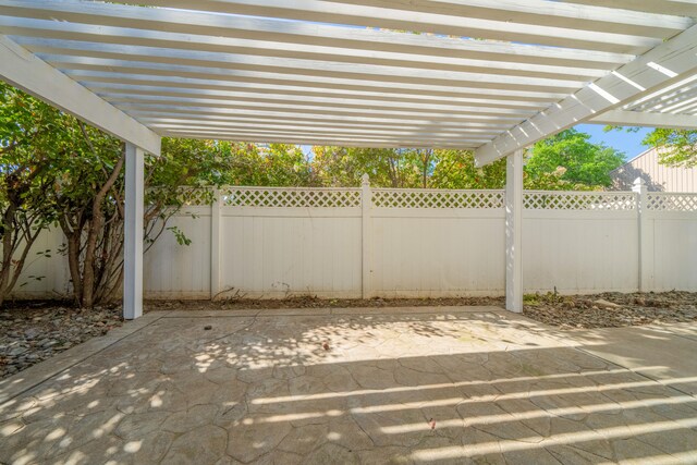 view of patio / terrace featuring a fenced backyard and a pergola