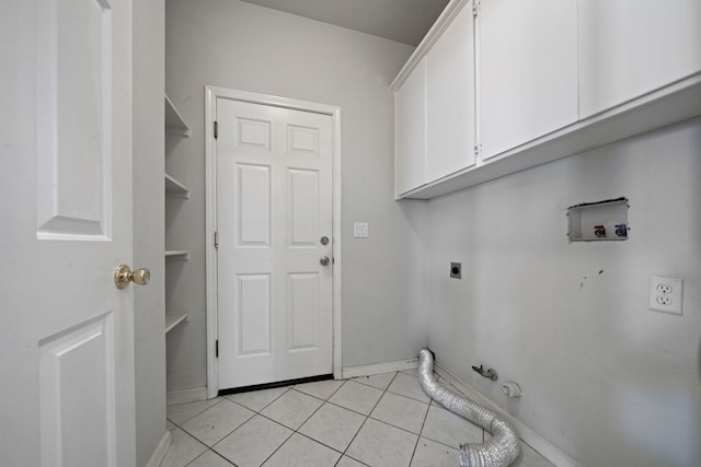 washroom with cabinets, light tile floors, hookup for a washing machine, hookup for an electric dryer, and gas dryer hookup