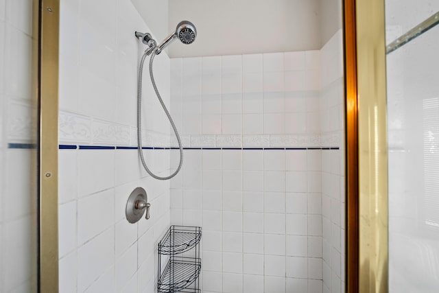 bathroom with a tile shower