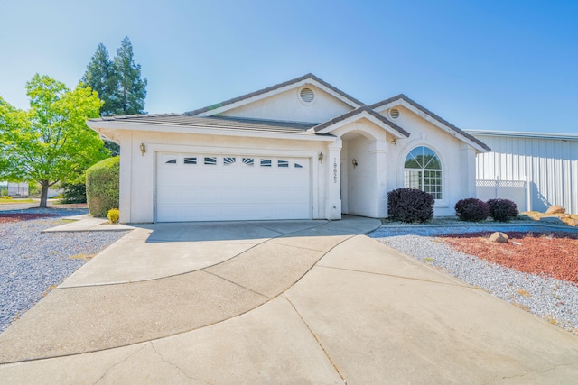 ranch-style home with a garage