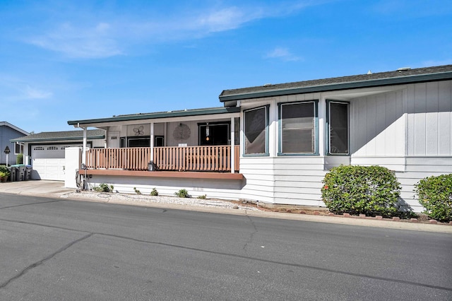 view of front of property featuring a garage and a porch