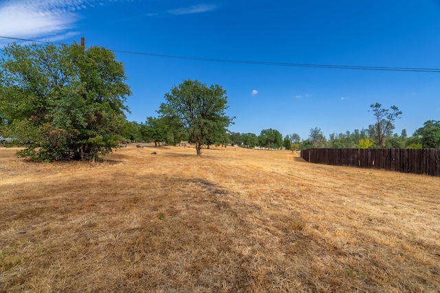 view of yard with a rural view