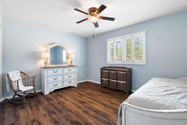 bedroom featuring ceiling fan and dark wood-type flooring