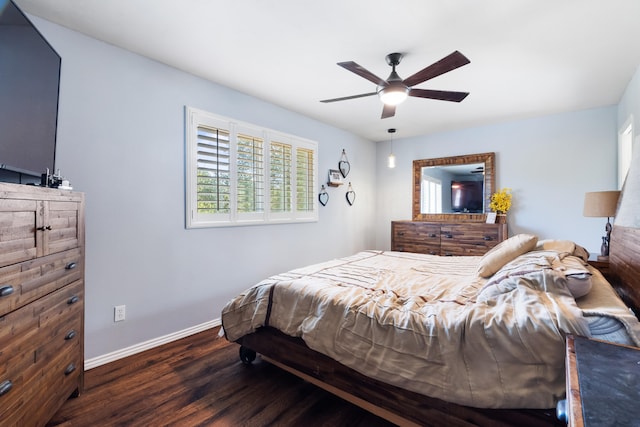 bedroom with ceiling fan and dark wood-type flooring