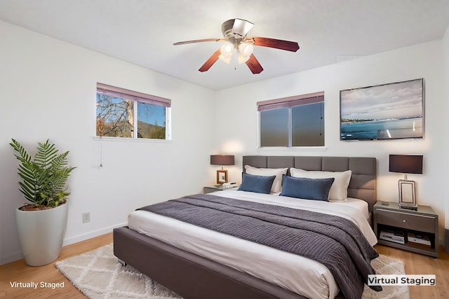 bedroom featuring ceiling fan and light wood-type flooring