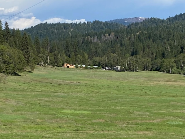 property view of mountains featuring a rural view