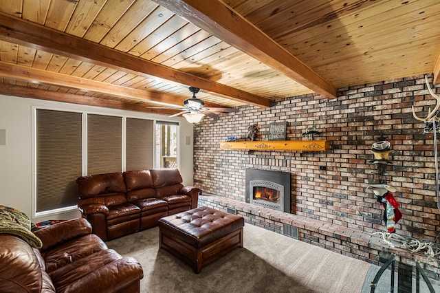 carpeted living room featuring a brick fireplace, ceiling fan, brick wall, beam ceiling, and wood ceiling