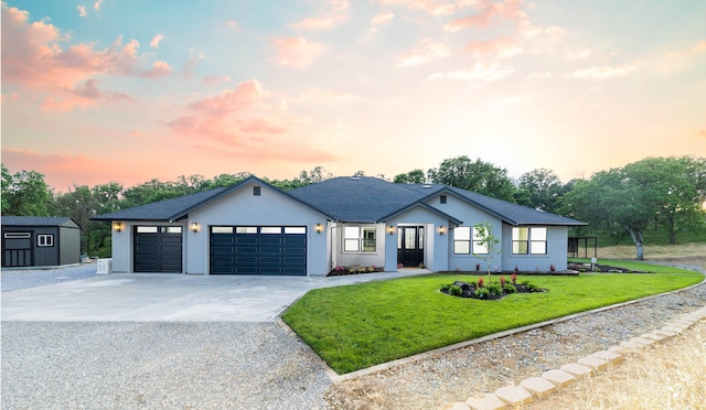 modern farmhouse style home with a garage and a lawn