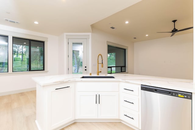 kitchen featuring white cabinets, light wood-type flooring, sink, dishwasher, and ceiling fan