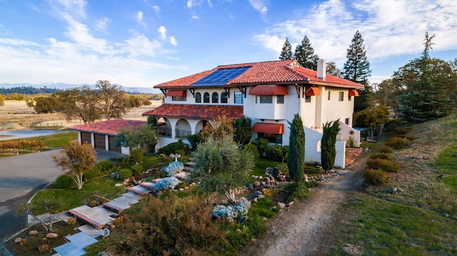 view of front of home featuring solar panels