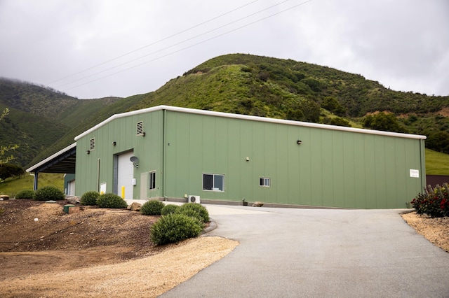 view of home's exterior with a mountain view