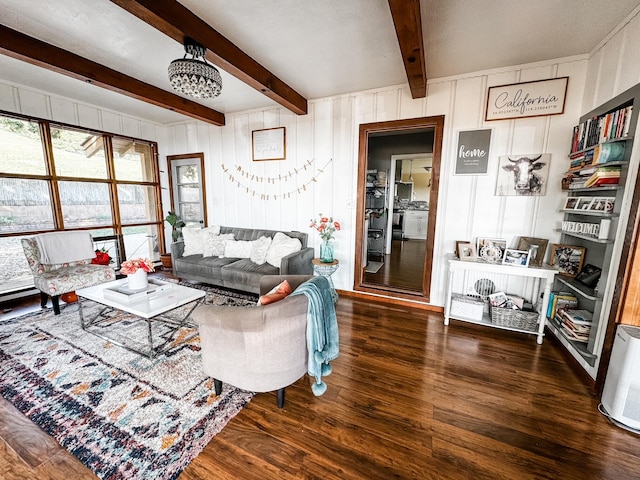 living room featuring beamed ceiling and dark hardwood / wood-style floors