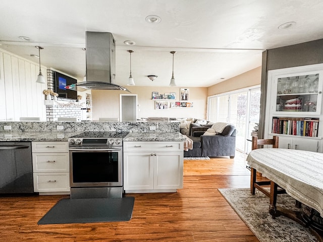 kitchen with island range hood, stainless steel appliances, white cabinets, and wood-type flooring