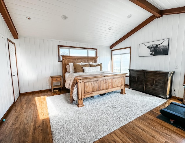 bedroom featuring lofted ceiling with beams and dark wood-type flooring