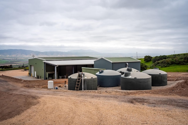 exterior space with a mountain view and an outdoor structure