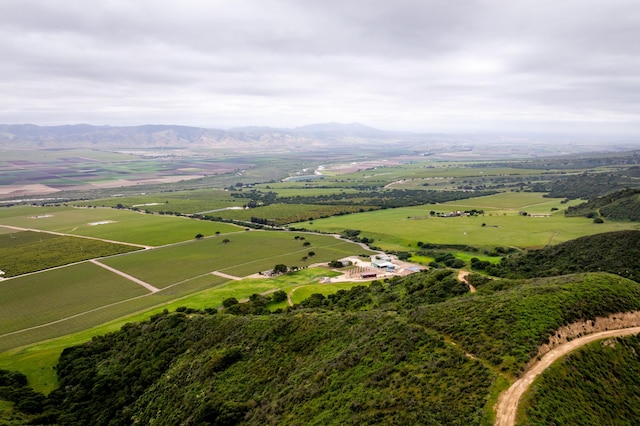 aerial view with a mountain view and a rural view