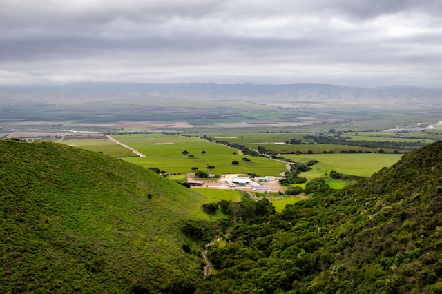 birds eye view of property featuring a mountain view and a rural view