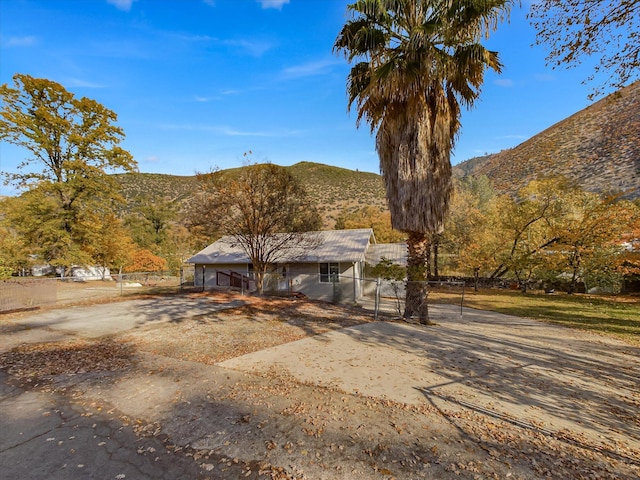 back of property featuring a mountain view