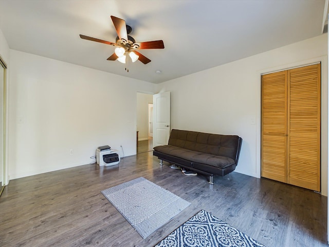 sitting room featuring ceiling fan and hardwood / wood-style flooring