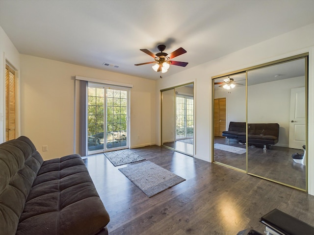 living room with a healthy amount of sunlight, hardwood / wood-style floors, and ceiling fan