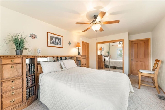 bedroom featuring a closet, carpet floors, and ceiling fan