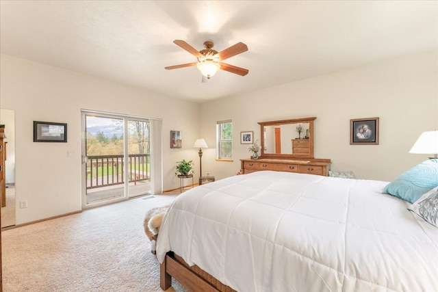 carpeted bedroom with ceiling fan and access to outside