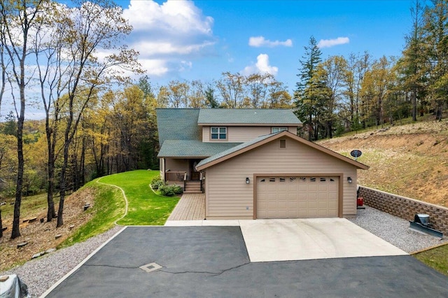 view of front of house with a garage and a front lawn