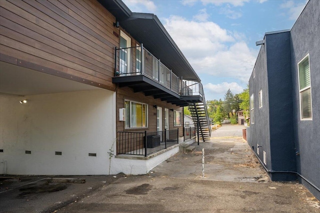 view of side of property with a balcony