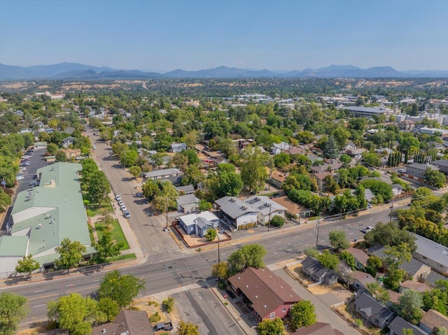 birds eye view of property with a mountain view