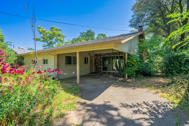 view of front of house with a carport