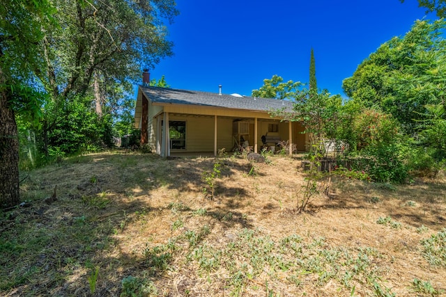 back of property featuring a patio