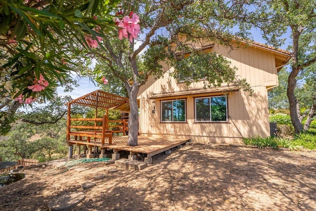 view of front of home featuring a pergola and a deck