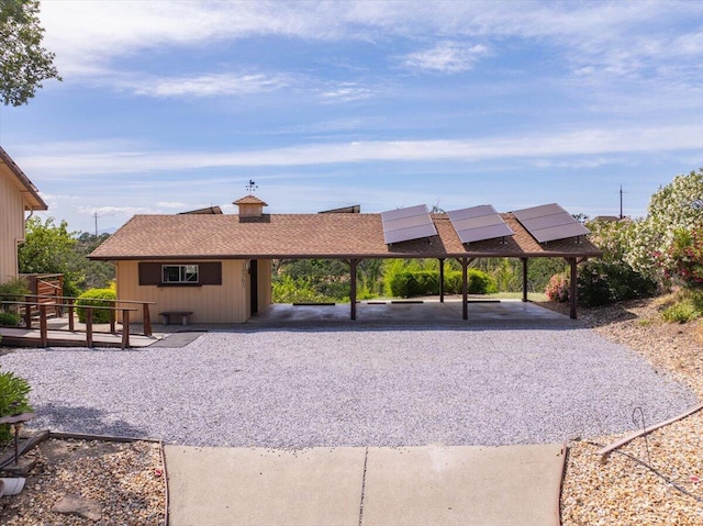 view of front of property featuring a carport