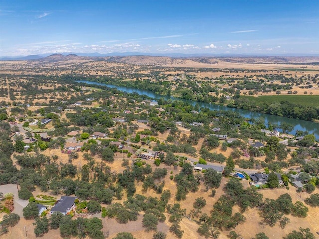 bird's eye view with a water and mountain view