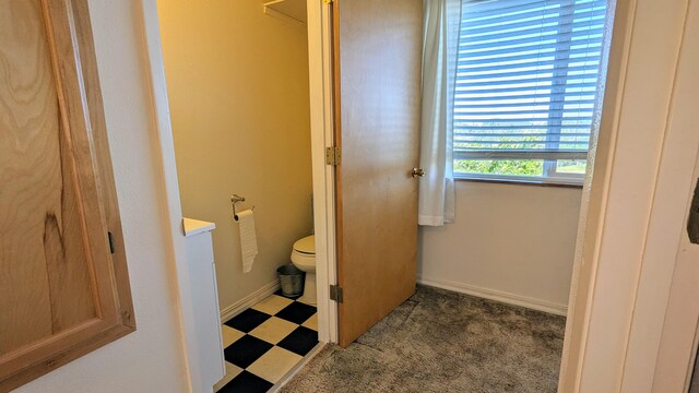 bathroom featuring tile patterned floors and toilet