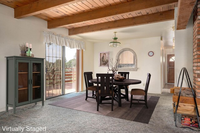 dining space with beamed ceiling, brick wall, and carpet floors