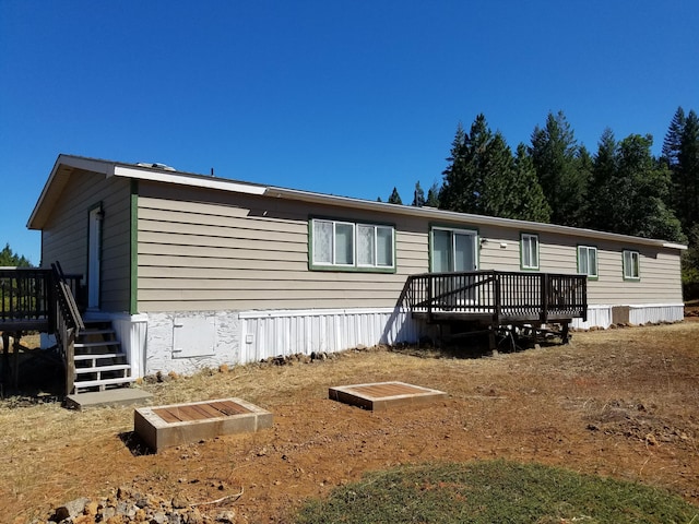 view of front of house featuring a wooden deck