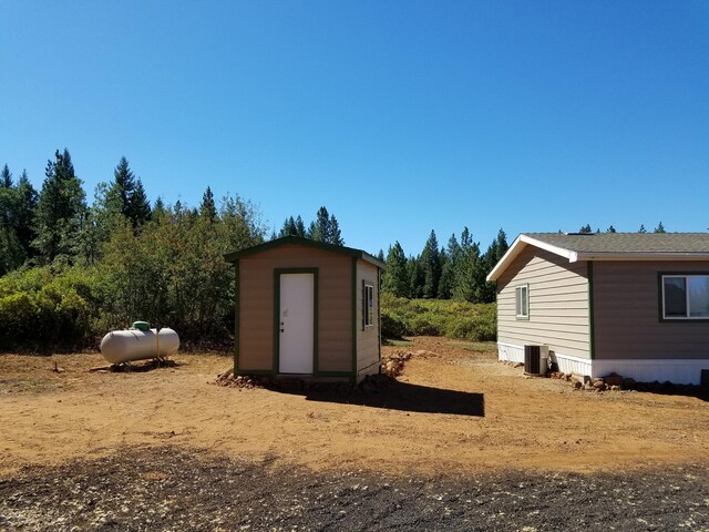 view of outdoor structure featuring central AC unit